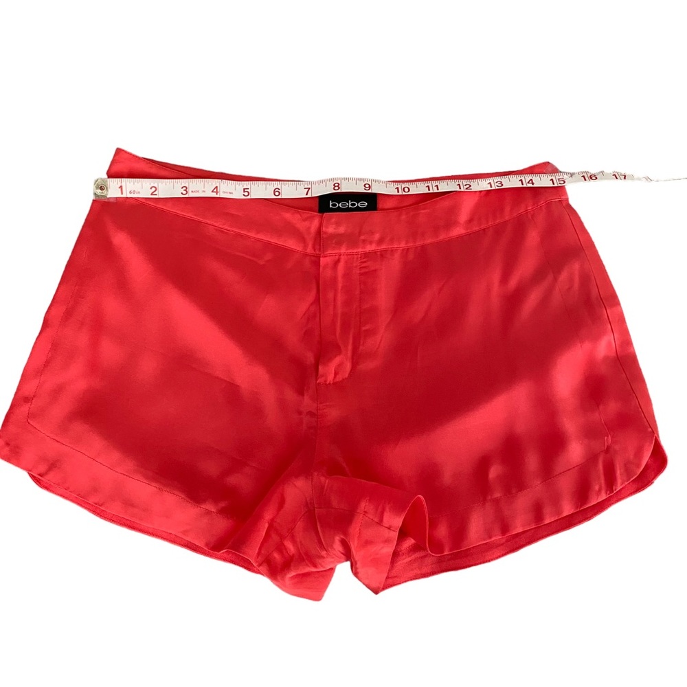 Bebe Silk low rise shorts. Bright Coral Orange. Size 2.  Measurements shown.